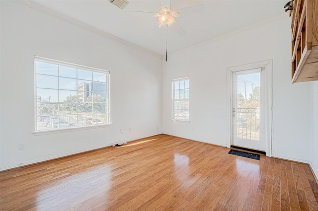 5031 Nolda St, Houston, TX 77007 - empty room featuring a ceiling fan, ornamental molding, wood finished floors, and visible vents