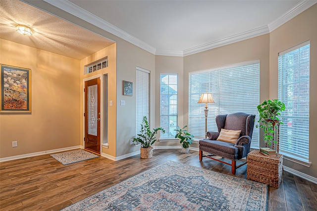 living area featuring dark hardwood / wood-style flooring and crown molding