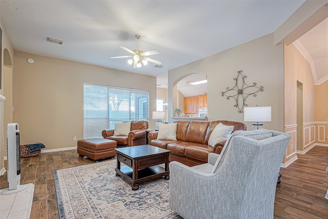 living room featuring hardwood / wood-style floors and ceiling fan