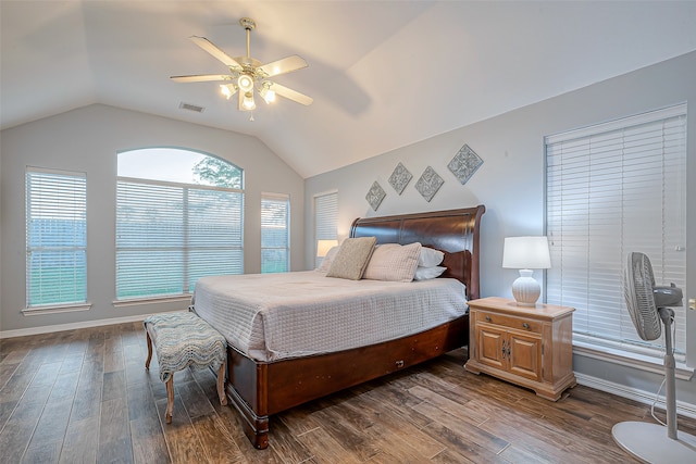 bedroom with dark hardwood / wood-style flooring, lofted ceiling, and ceiling fan