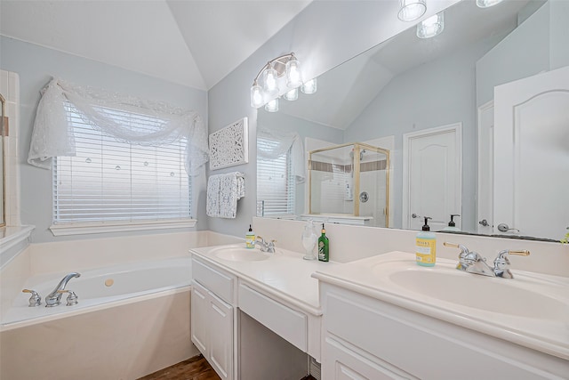 bathroom featuring vanity, plus walk in shower, and lofted ceiling