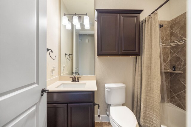 full bathroom with vanity, shower / tub combo, and toilet