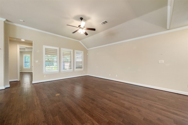 empty room with dark hardwood / wood-style flooring, vaulted ceiling, ceiling fan, and crown molding