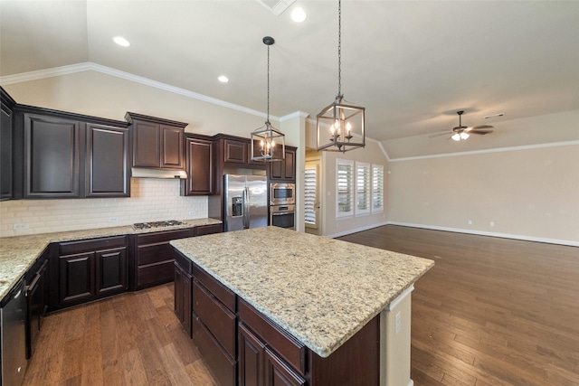 kitchen featuring a kitchen island, appliances with stainless steel finishes, dark hardwood / wood-style floors, lofted ceiling, and hanging light fixtures