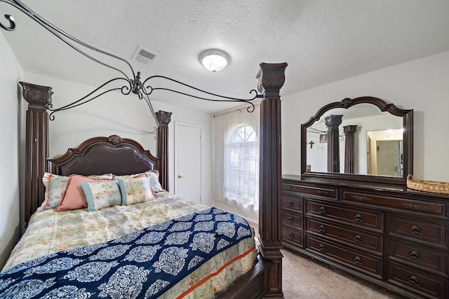 carpeted bedroom with a textured ceiling