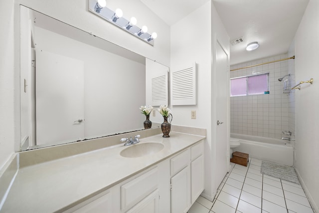 full bathroom with toilet, vanity, tile patterned floors, and tiled shower / bath combo