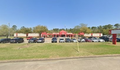 view of parking featuring a yard