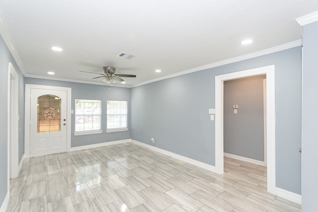 foyer entrance featuring ornamental molding, a textured ceiling, and ceiling fan