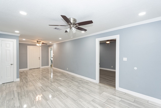 empty room featuring a textured ceiling, ceiling fan, and crown molding