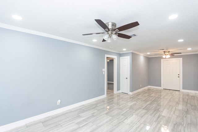 unfurnished room featuring ceiling fan and crown molding