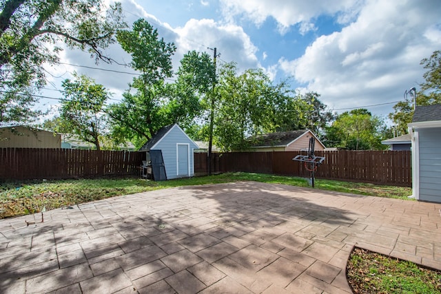 view of patio / terrace with a shed