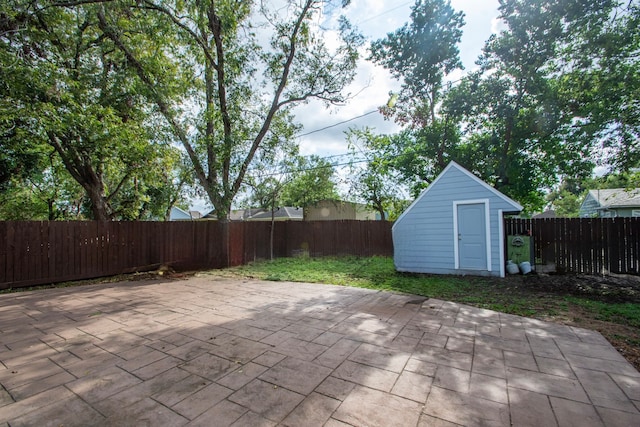 view of patio / terrace featuring a storage shed