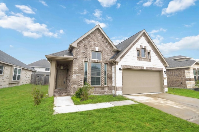 view of front of property with a front yard and a garage