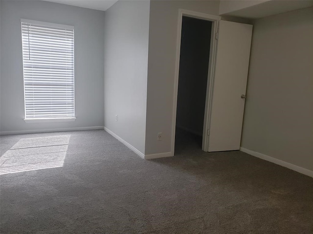 spare room with carpet and plenty of natural light