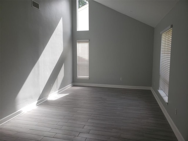 bonus room with high vaulted ceiling, visible vents, baseboards, and wood finished floors