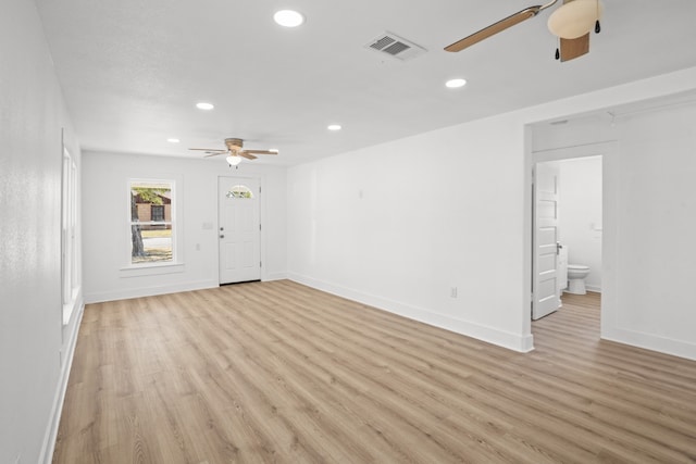 spare room with light hardwood / wood-style floors and ceiling fan