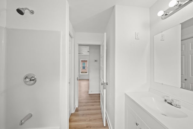 bathroom with hardwood / wood-style floors and vanity