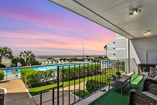 balcony at dusk with a water view