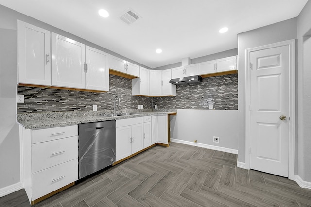 kitchen featuring dishwasher, sink, and white cabinets