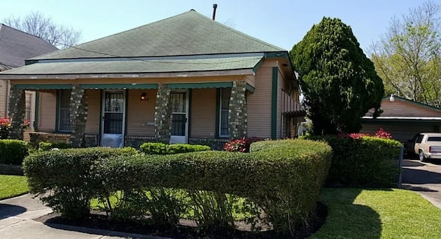 view of property exterior with a porch