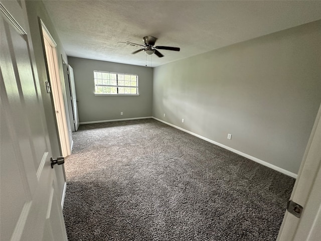 unfurnished bedroom with a textured ceiling, carpet flooring, and ceiling fan