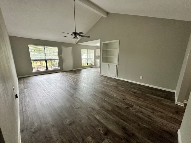 unfurnished living room with ceiling fan, dark hardwood / wood-style floors, and vaulted ceiling with beams