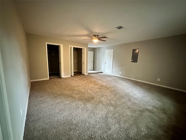 unfurnished bedroom featuring ceiling fan and carpet