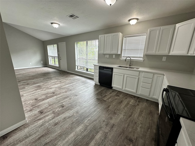 kitchen with vaulted ceiling, hardwood / wood-style floors, black appliances, sink, and white cabinetry