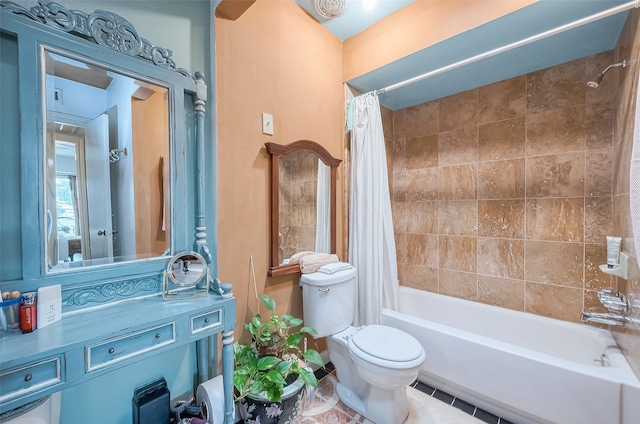 bathroom with shower / tub combo with curtain, tile patterned floors, and toilet