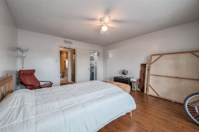 bedroom featuring hardwood / wood-style flooring and ceiling fan