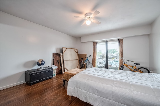 bedroom featuring dark hardwood / wood-style flooring and ceiling fan