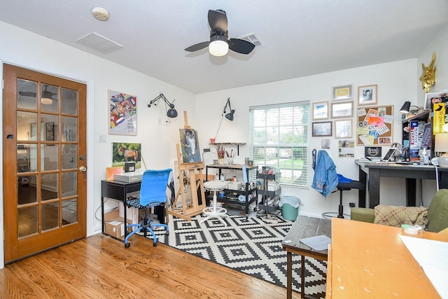 office featuring ceiling fan and light hardwood / wood-style flooring