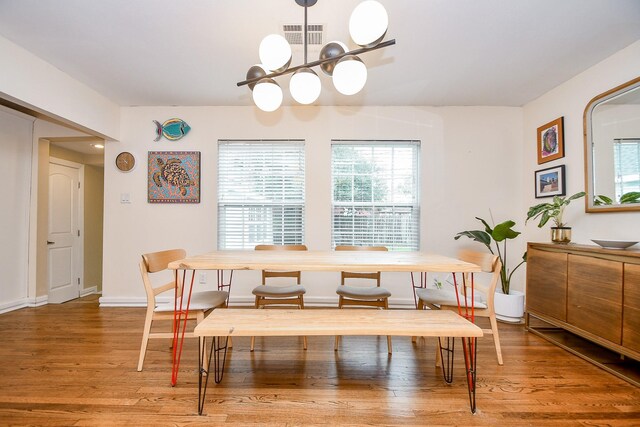 dining area with wood-type flooring