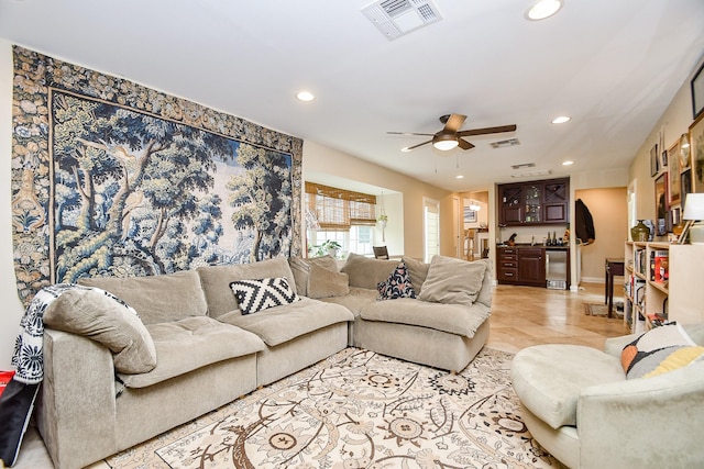 living room featuring ceiling fan and light tile patterned flooring