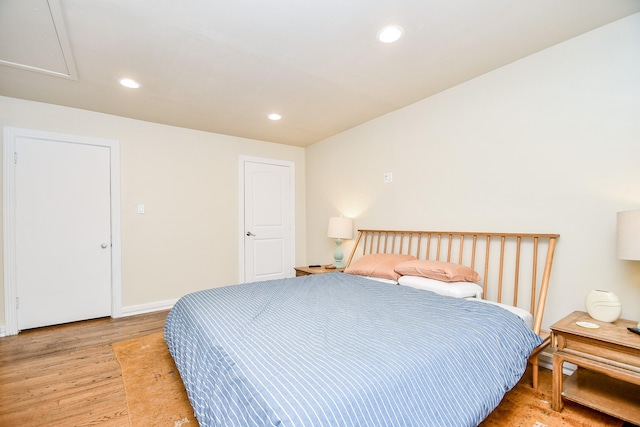 bedroom with light hardwood / wood-style flooring