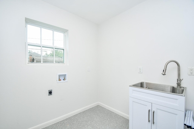 washroom featuring washer hookup, sink, cabinets, and hookup for an electric dryer