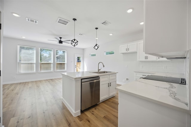 kitchen with white cabinetry, pendant lighting, sink, stainless steel dishwasher, and a kitchen island with sink