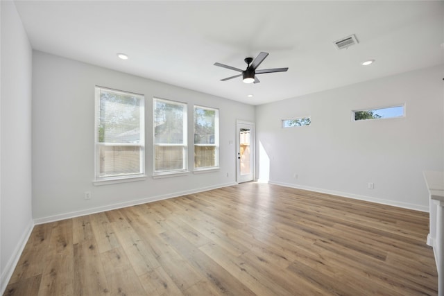 spare room with ceiling fan and light hardwood / wood-style flooring