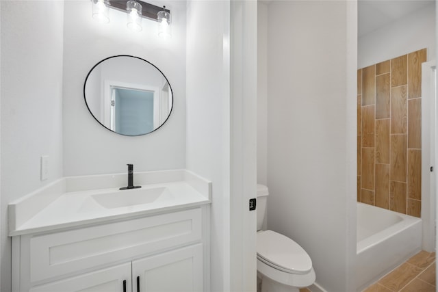 full bathroom featuring vanity, toilet, and tiled shower / bath