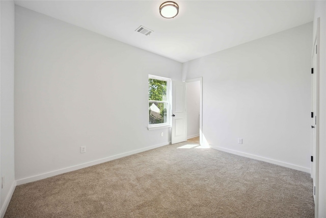 spare room featuring carpet floors