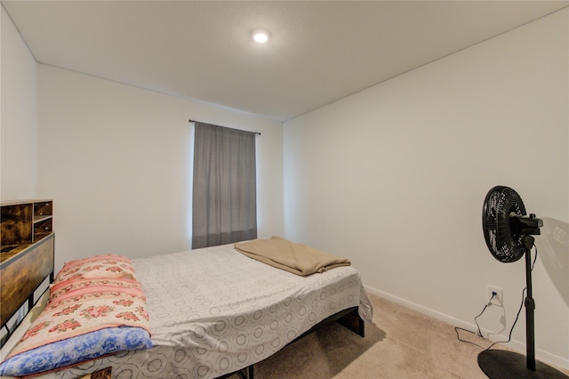 bedroom featuring light colored carpet