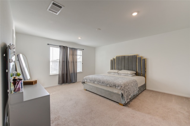 bedroom featuring light carpet