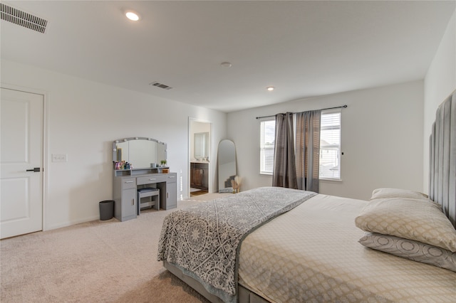 bedroom with light carpet