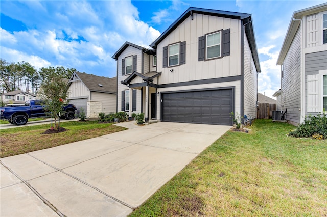 view of front of property with a front lawn, a garage, and cooling unit