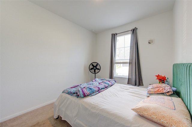 carpeted bedroom featuring lofted ceiling