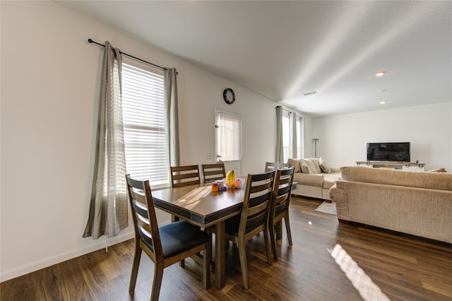 dining area with dark wood-type flooring