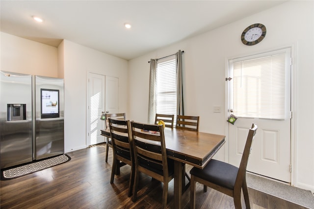 dining space with dark hardwood / wood-style floors