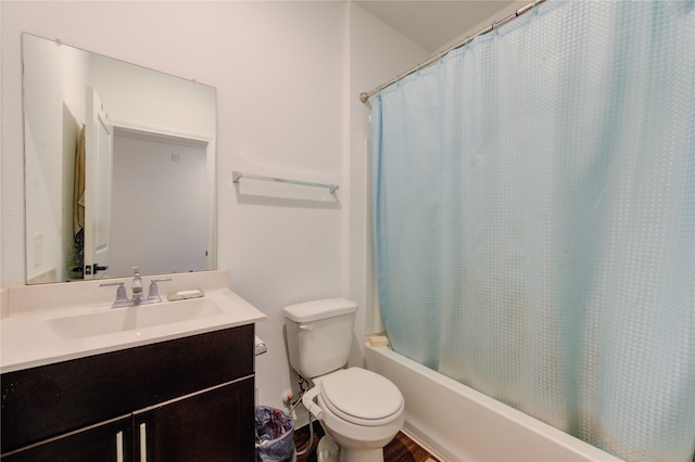 full bathroom with shower / bath combo, vanity, and toilet