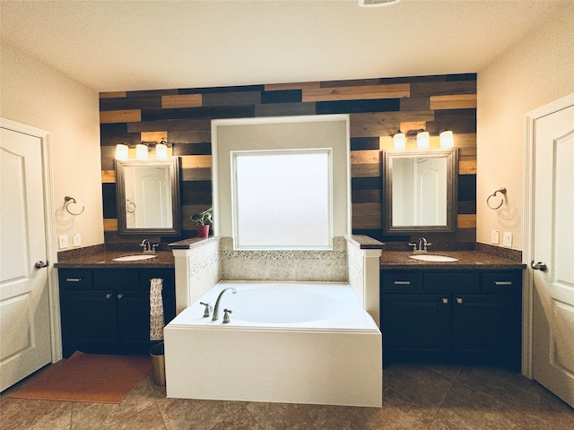 bathroom featuring wood walls, a tub to relax in, and vanity