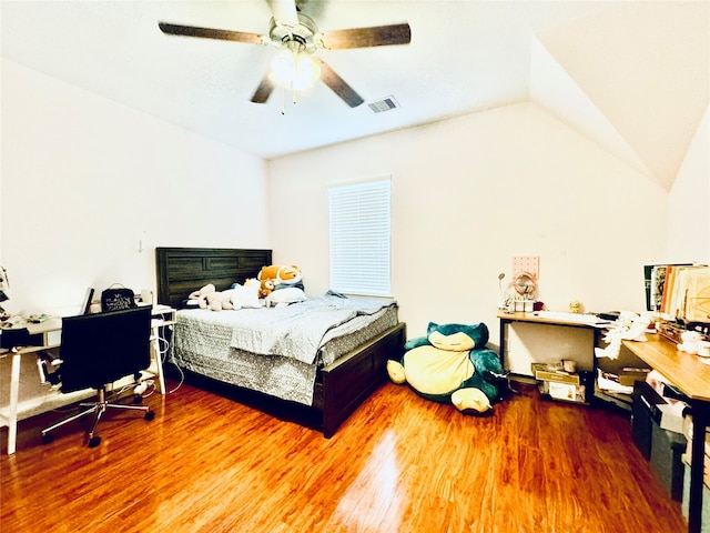 bedroom with lofted ceiling, hardwood / wood-style floors, and ceiling fan